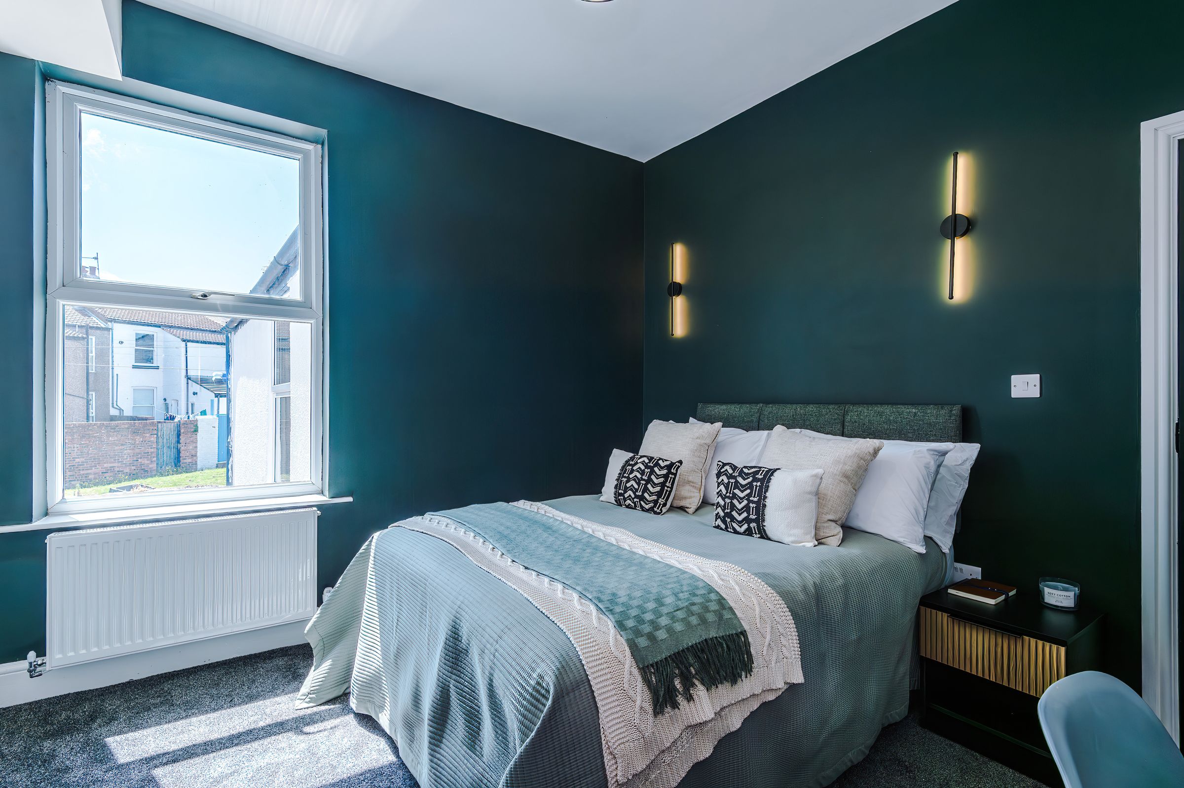 Furnished double room with feature wall lights